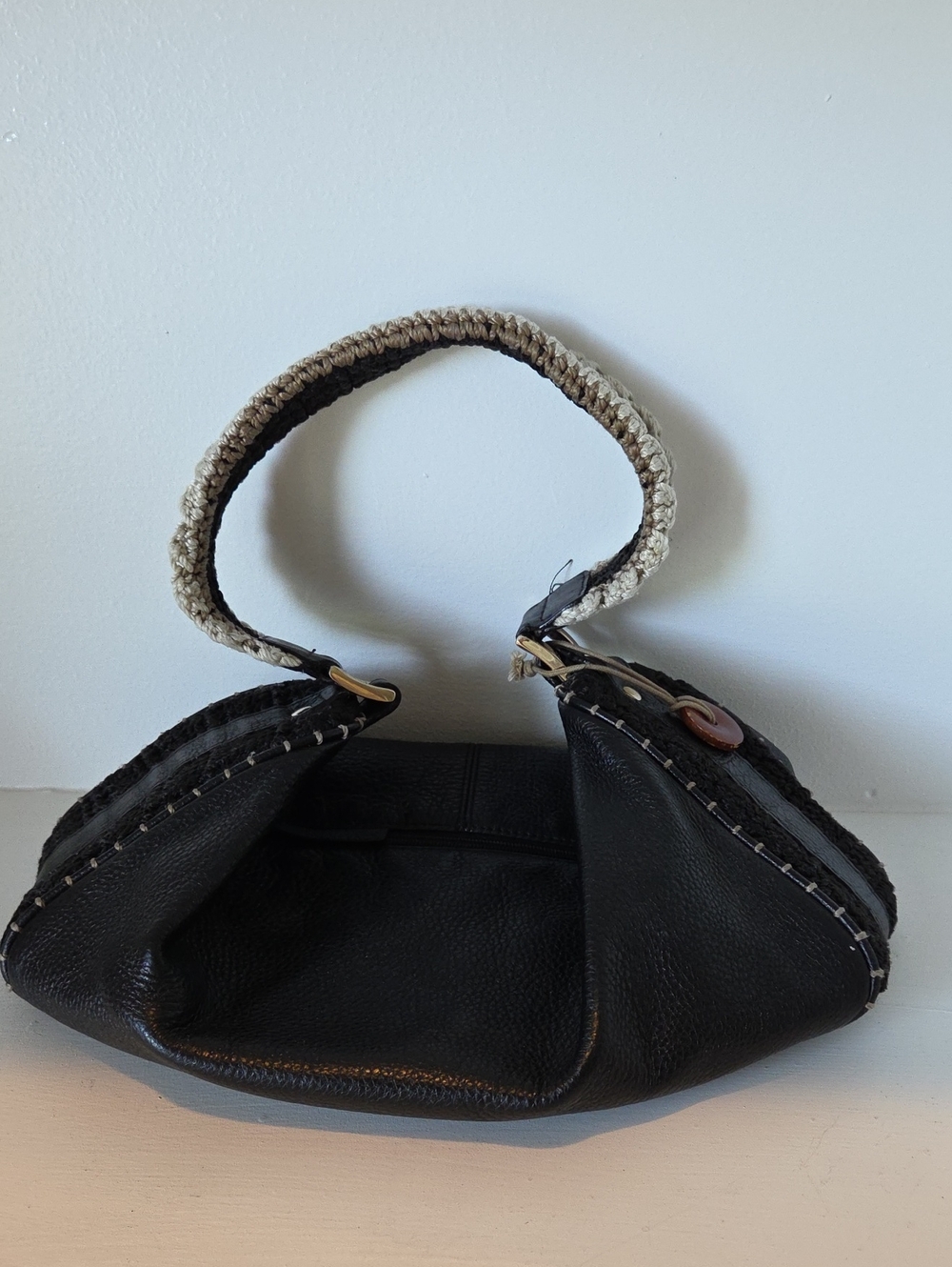 The Sak Pink Label knitted handle black leather handbag.